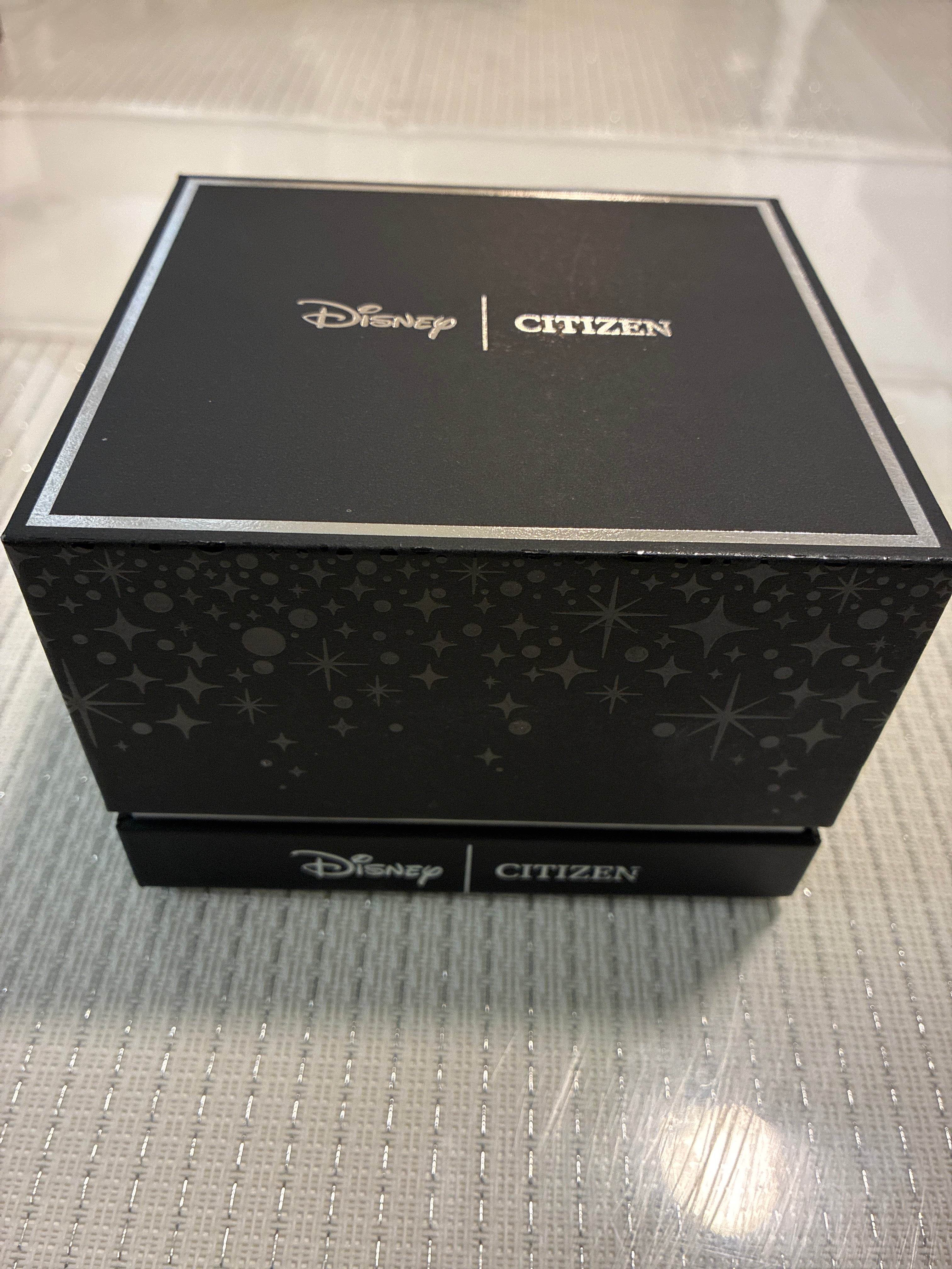 Citizen Eco-Drive Disney Cinderella Box Set features a watch with a crystal-encrusted bezel and a white mother-of-pearl dial