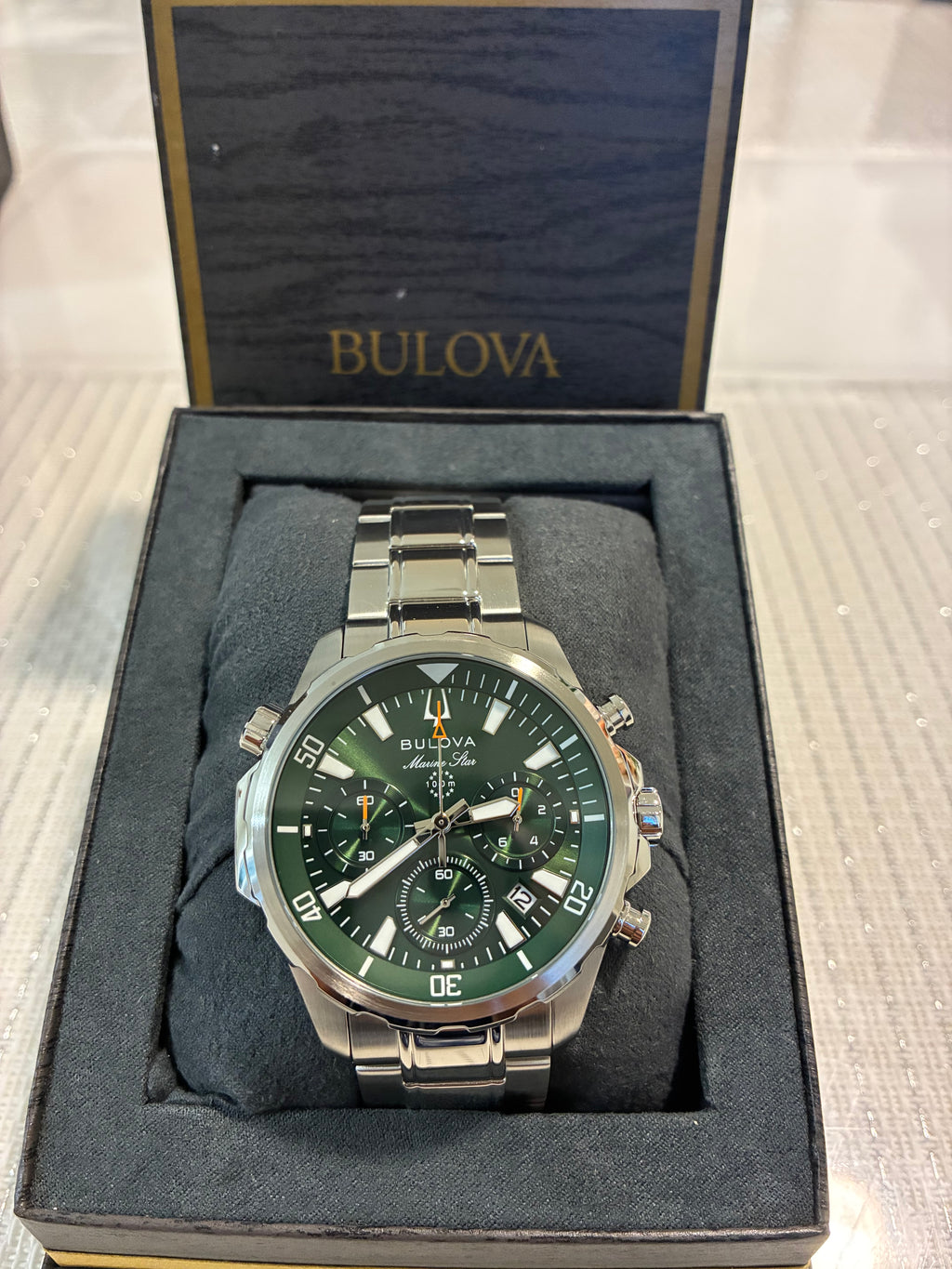 Bulova Marine Star (model 96B396) features a striking green dial housed in a durable stainless steel case.